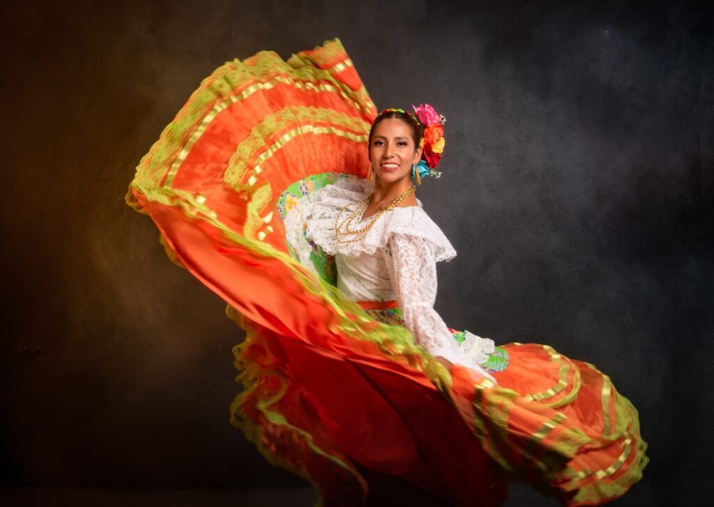 A woman in a colorful dress is dancing and her skirt is flowing
